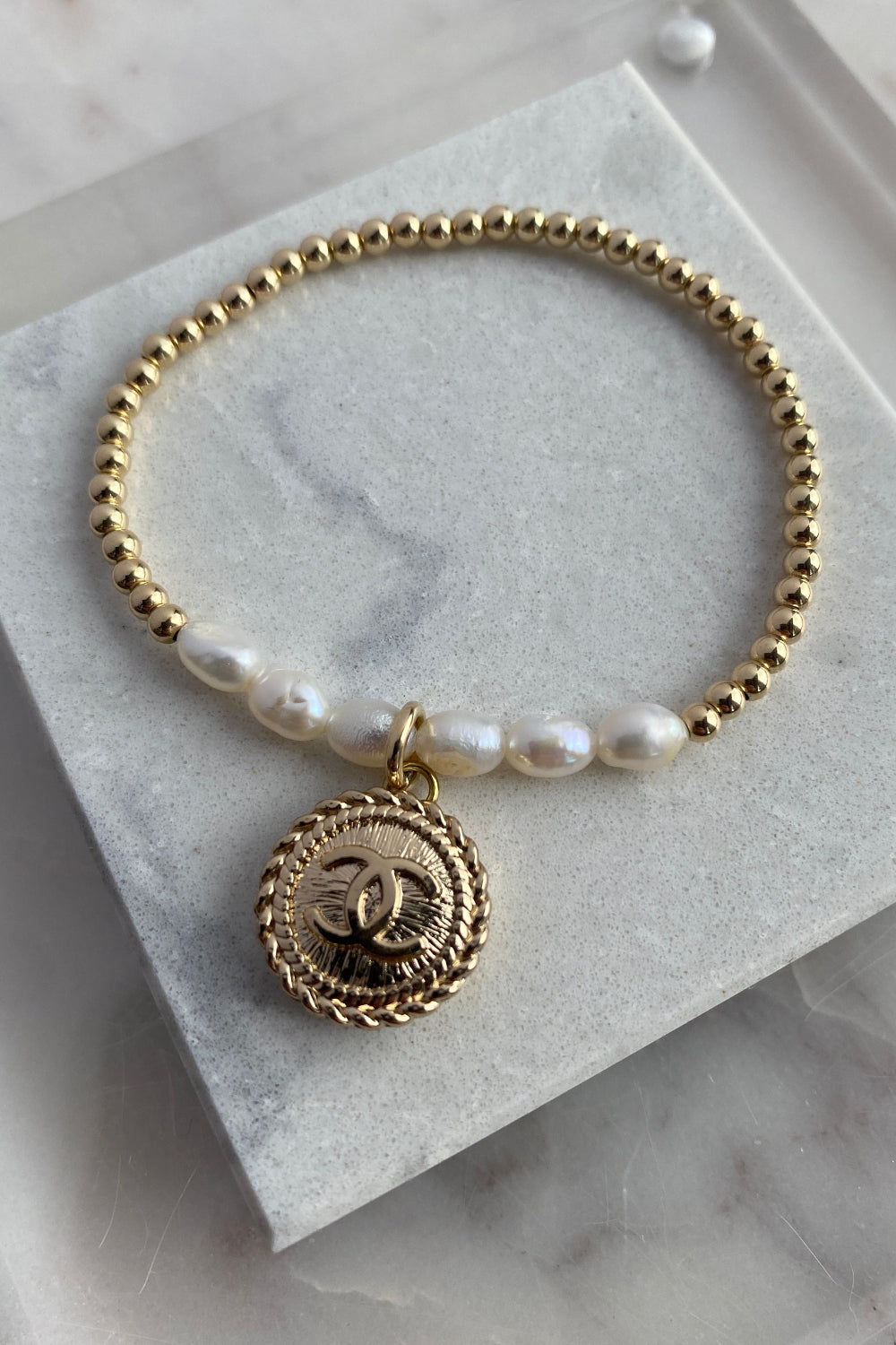 .Designer Gold Pearl Charm Bracelet