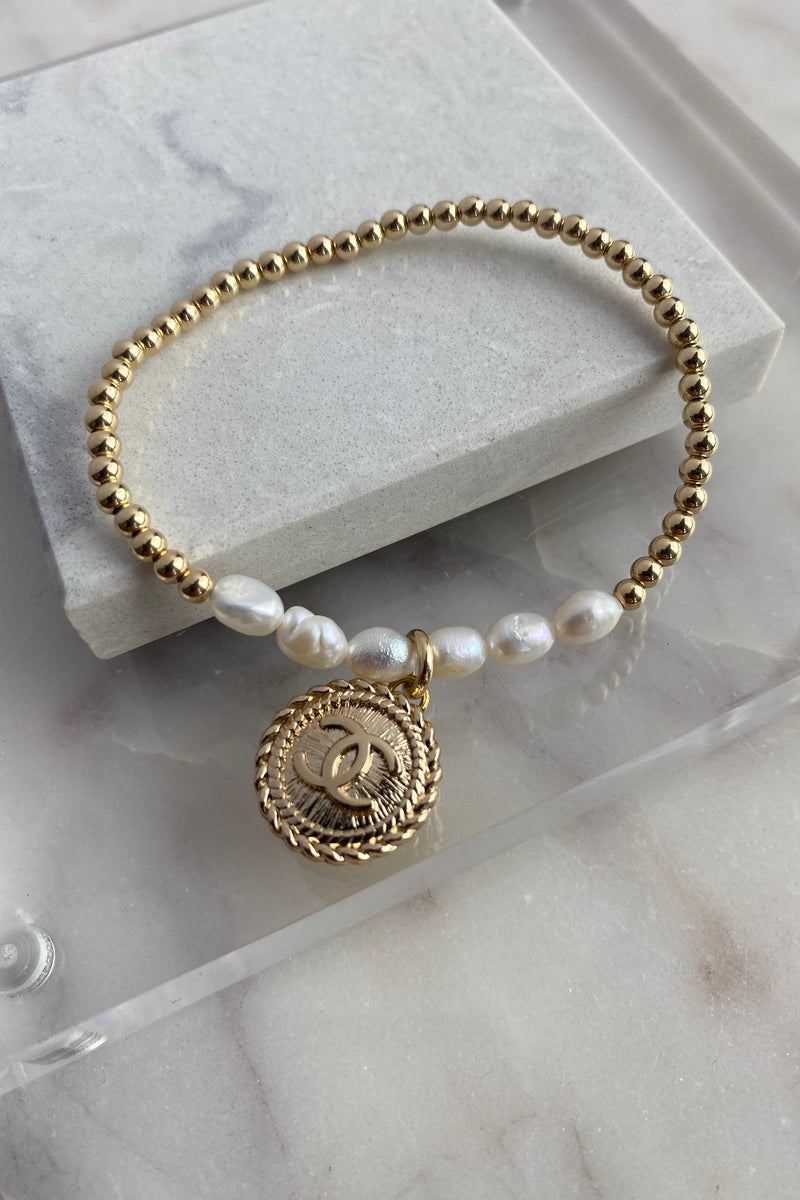 .Designer Gold Pearl Charm Bracelet