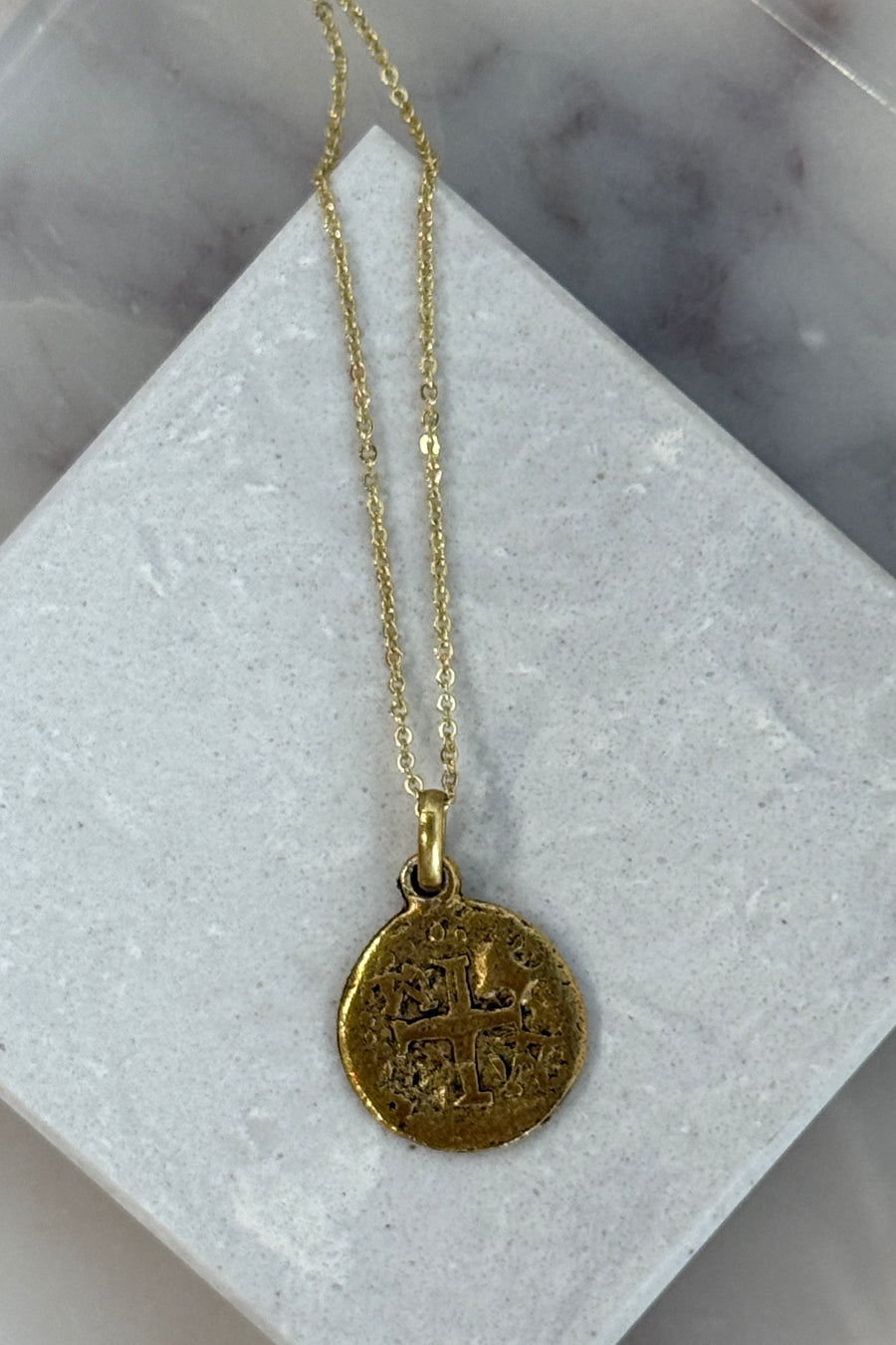 .Embossed Cross Medallion