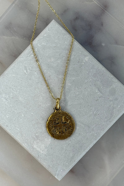 .Embossed Cross Medallion